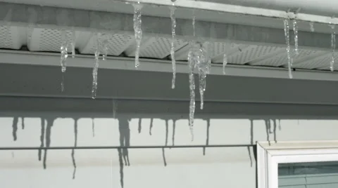 Jib move across winter icicles 4K Stock Footage 45920274