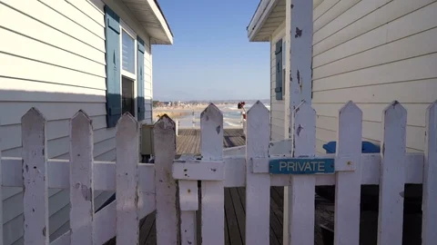 Jib Up Reveal Beach Between Two Houses on Pier Stock Footage 96038246