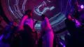 Jib shot from low angle to high angle, people dance in night club during party HD Footage