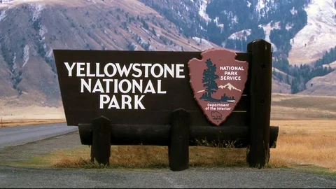A jib shot of the Yellowstone National Park sign. Stock Footage
