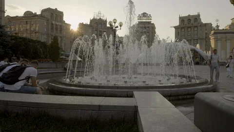 Jib style rise behind backlit fountain on Independence Square Kiev Stock Footage 93124017