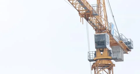 Jib of a yellow tower crane Stock Footage 146034003