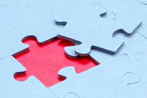 Jigsaw with one piece missing Stock Photos