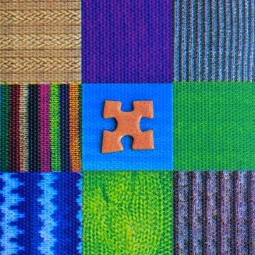 Jigsaw piece on a mosaic pattern Foto stock