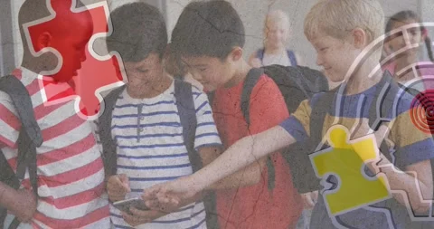 Jigsaw puzzle and human head icon against diverse group of boys using smartphone Stock Footage 327898708