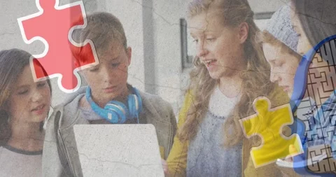Jigsaw puzzle and human head icon over diverse group of students using laptop at Stock Footage 327957708