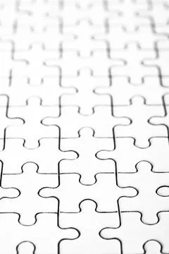 Jigsaw puzzle. back side. white pieces forming flawless pattern 스톡 사진