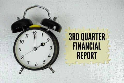 Jigsaw puzzle with a missing piece with "3rd Quarter Financial Report" and .. Stock Photos