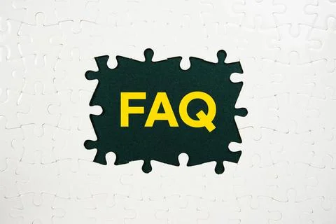 Jigsaw puzzle with a missing piece with "FAQ" on navy blue background Stock Photos