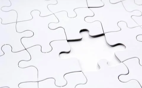 Jigsaw Puzzle Missing Piece Jigsaw puzzle in white with a missing piece Co... Stock Photos