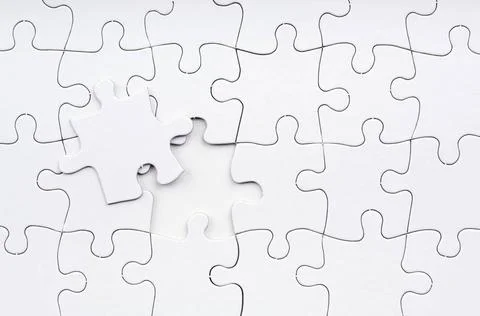 Jigsaw Puzzle Missing Piece Jigsaw puzzle in white with a missing piece Co... Stock Photos