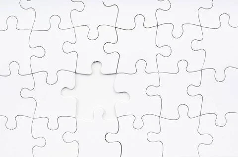 Jigsaw Puzzle Missing Piece Jigsaw puzzle in white with a missing piece Co... Stock Photos