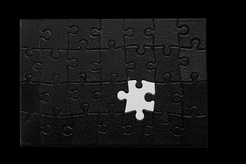 A jigsaw puzzle with a missing piece Stock Photos