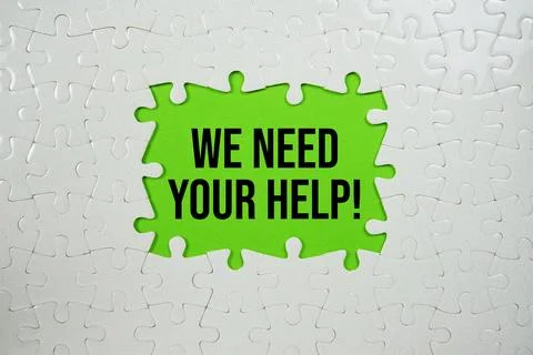 Jigsaw puzzle with a missing piece with "We Need Your Help!" on green backg.. Stock Photos