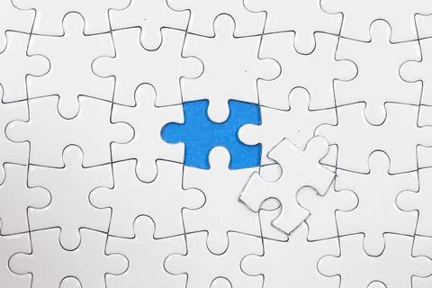 Jigsaw puzzle with one piece missing Stock Photos