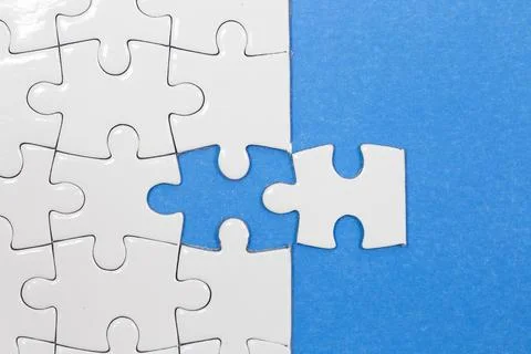 Jigsaw puzzle with one piece missing Stock Photos