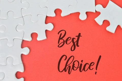Jigsaw puzzle over red background written with BEST CHOICE! Stock Photos