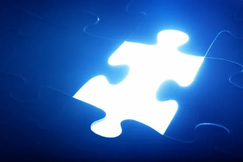 Jigsaw puzzle piece missing. Light glow from empty space. Search for the solu 스톡 사진