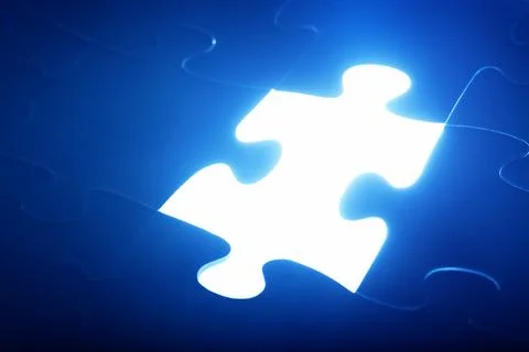 Jigsaw puzzle piece missing. Light glowing. Solution, solve the problem. Fotos de archivo