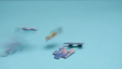 Jigsaw puzzle pieces falling down. Falling down randomly puzzles fill the screen Stock Footage 132463826
