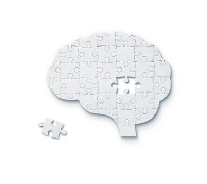 Jigsaw puzzle in shape of human brain Stock Photos