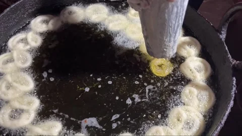 Jilapi being made at the fair Stock Footage 313501956