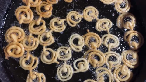 Jilapi being made at the fair Stock Footage 313503701