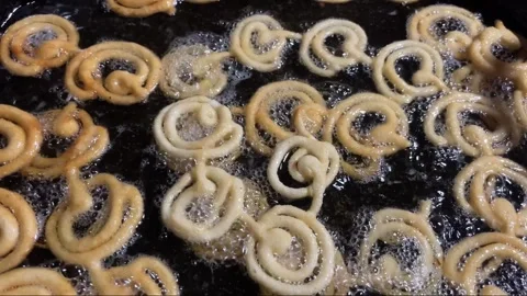 Jilapi being made at the fair Stock Footage 313503995