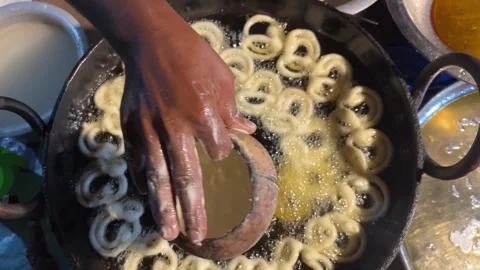 Jilapi being made at the fair Stock Footage 313503999