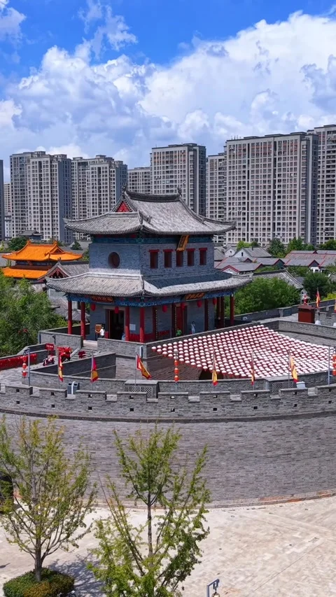 Jimo Ancient City Gate Contrasting Qingdao's Modern Skyline Stock Footage 330797034