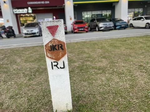 JKR Road Marker Post on Grass Stock Photos