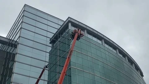 JLG - Ultra Boom - Construction - Window Repair Stock Footage 203802014