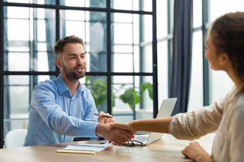 Job applicant having interview. Handshake while job interviewing. Stock Photos