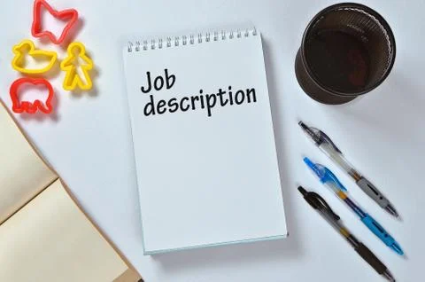 Job description text on notepad with office accessories. Business motivation, Stock Photos