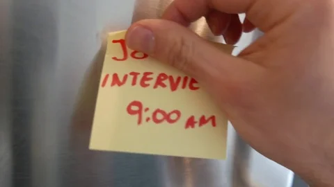 JOB INTERVIEW Appointment Sticky Note Reminder on Fridge 库存影片 79535197