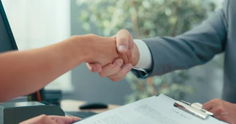 Job interview in company office, contract conclusion, handshake, congratulations Stock Footage