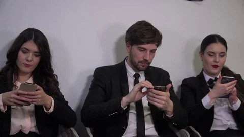 Job interview room businessman in the office business women sliding smartphone Stock Footage