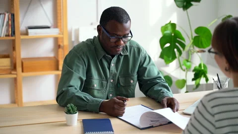 Job interview for vacancy job Spbas. Black boss holding resume during corporate Stock Footage 142777241