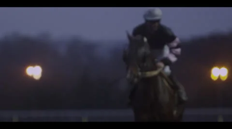 JOCKEY ON HORSE - NIGHT Stock Footage