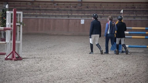 Jockeys go the route with the coach Stock Footage 128169697