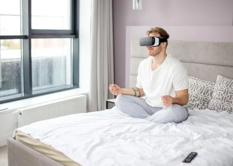 Joga with virtual reality. side view photo. technology, sport concept Stock Photos