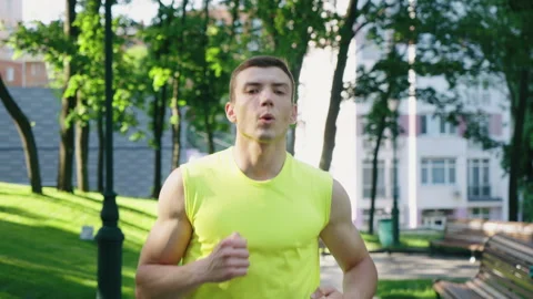 Jogger exercising in park in slow motion Stock Footage 155915983