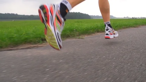Jogger legs close up slow motion Stock Footage 118830748