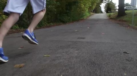 Jogger Running along Wooded Path Stock Footage 47215461