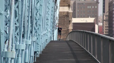 JOGGER RUNNING ON BRIDGE, CINCINNATI Video stock 59184051