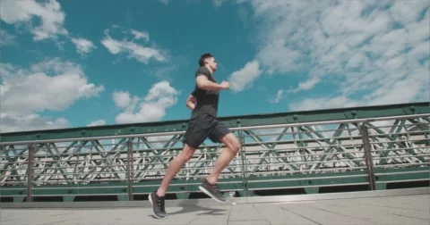 Jogger running over bridge. Vídeo Stock 58860734