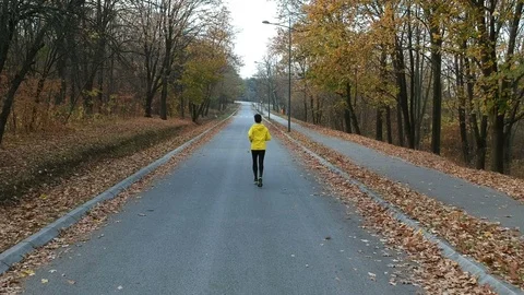 Jogger running in the park Stock Footage 98578234