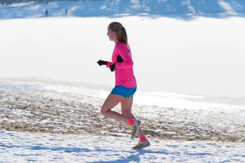 Jogger in snow Stock Photos
