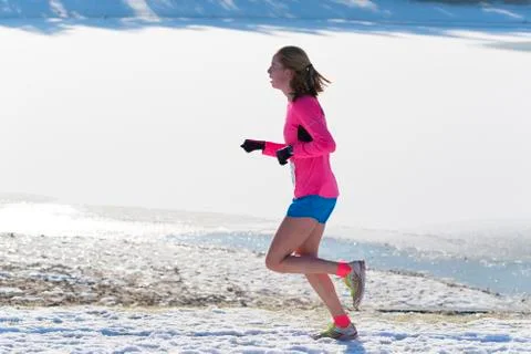 Jogger in snow Stock Photos