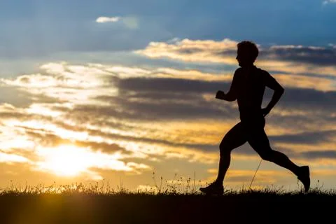Jogger in sundown Stock Photos